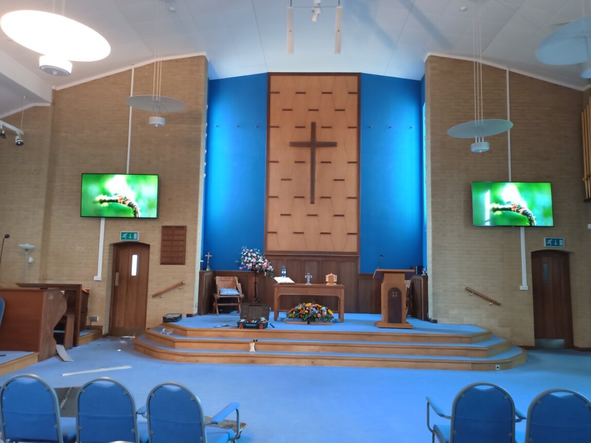 Large format display mounted in a meeting room